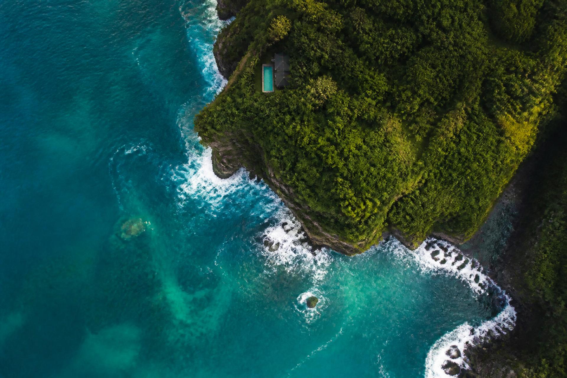Aerial view of a luxury coastline with turquoise water